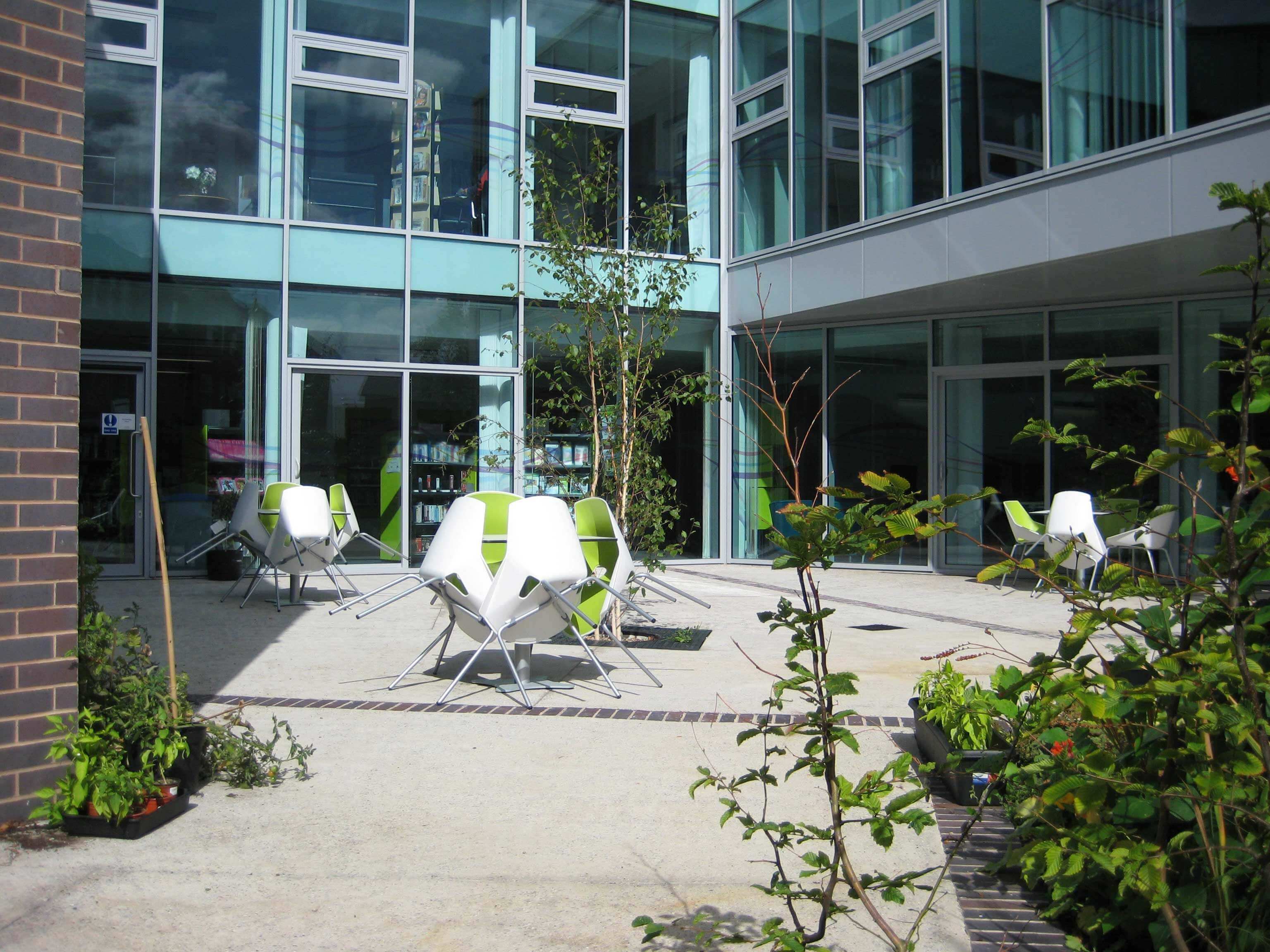Redesigned and Renovated Library Courtyard with community growing garden completed by Petrow Harley